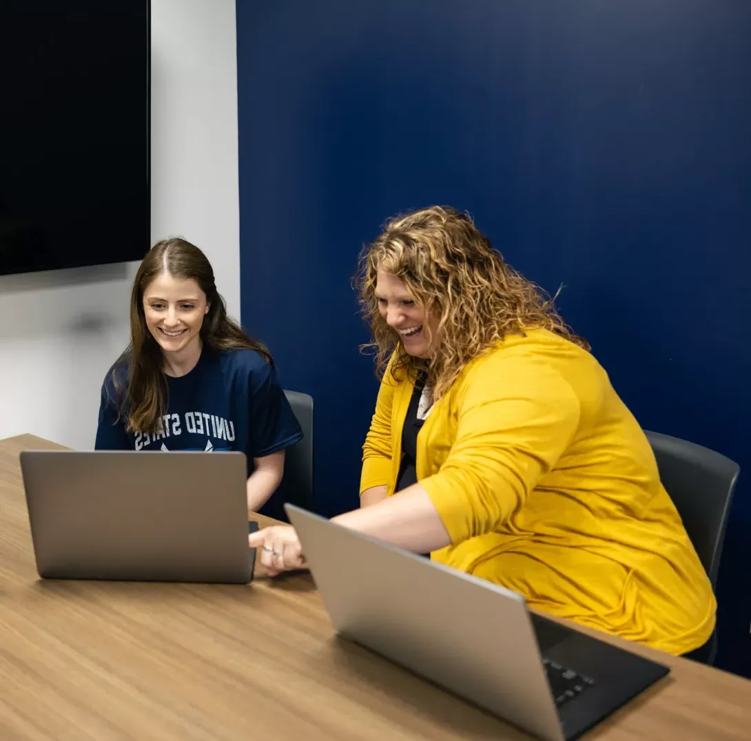 Photo of student and staff member